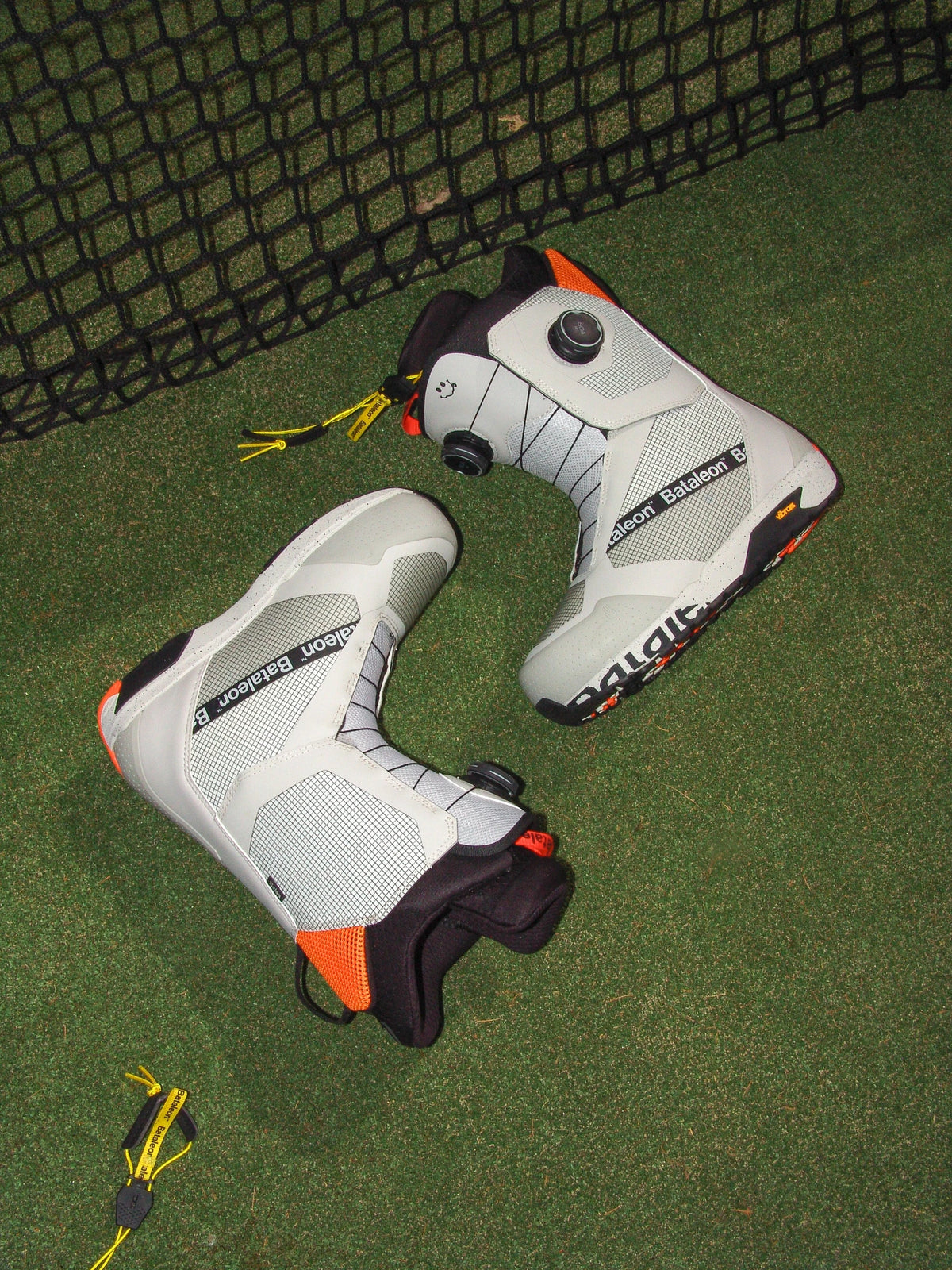Men's Bataleon Salsa Double BOA snowboard boots in gray sunset with a lifestyle shot, showcasing the snowboard boots' design and fit.