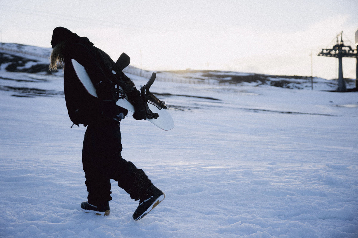 Black Bataleon Salsa Lace snowboard boots for men, showing the snowboard boots with laces and padding in a lifestyle setting.