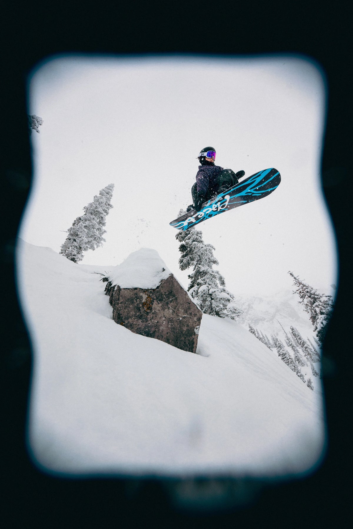Men's Bataleon Placebo snowboard with bold graphics, designed for all-mountain snowboarding in a lifestyle setting.