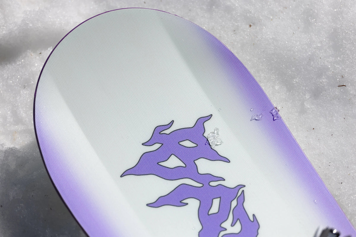 Bataleon Women's Disaster snowboarding snowboard with colorful graphic design, suitable for winter sports and snowboarding adventures.