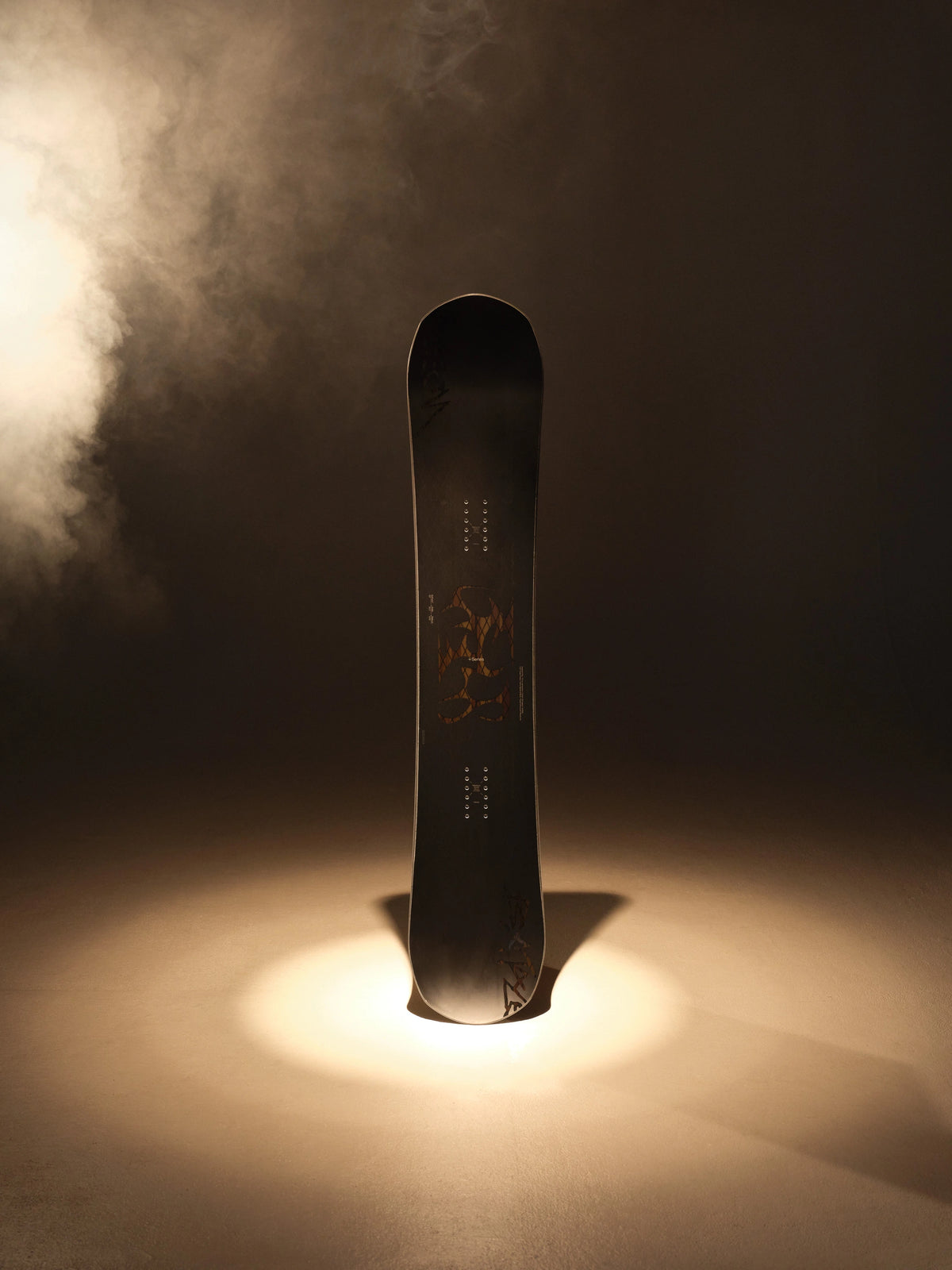 Black Bataleon Evil Twin+ snowboard for men, showing the twin-tip design and graphic details, ideal for all-mountain snowboarding.