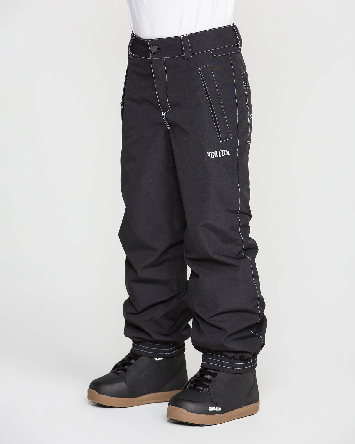 Volcom Kids' Chaos insulated snow pants in black, side view with adjustable waistband and reinforced knees