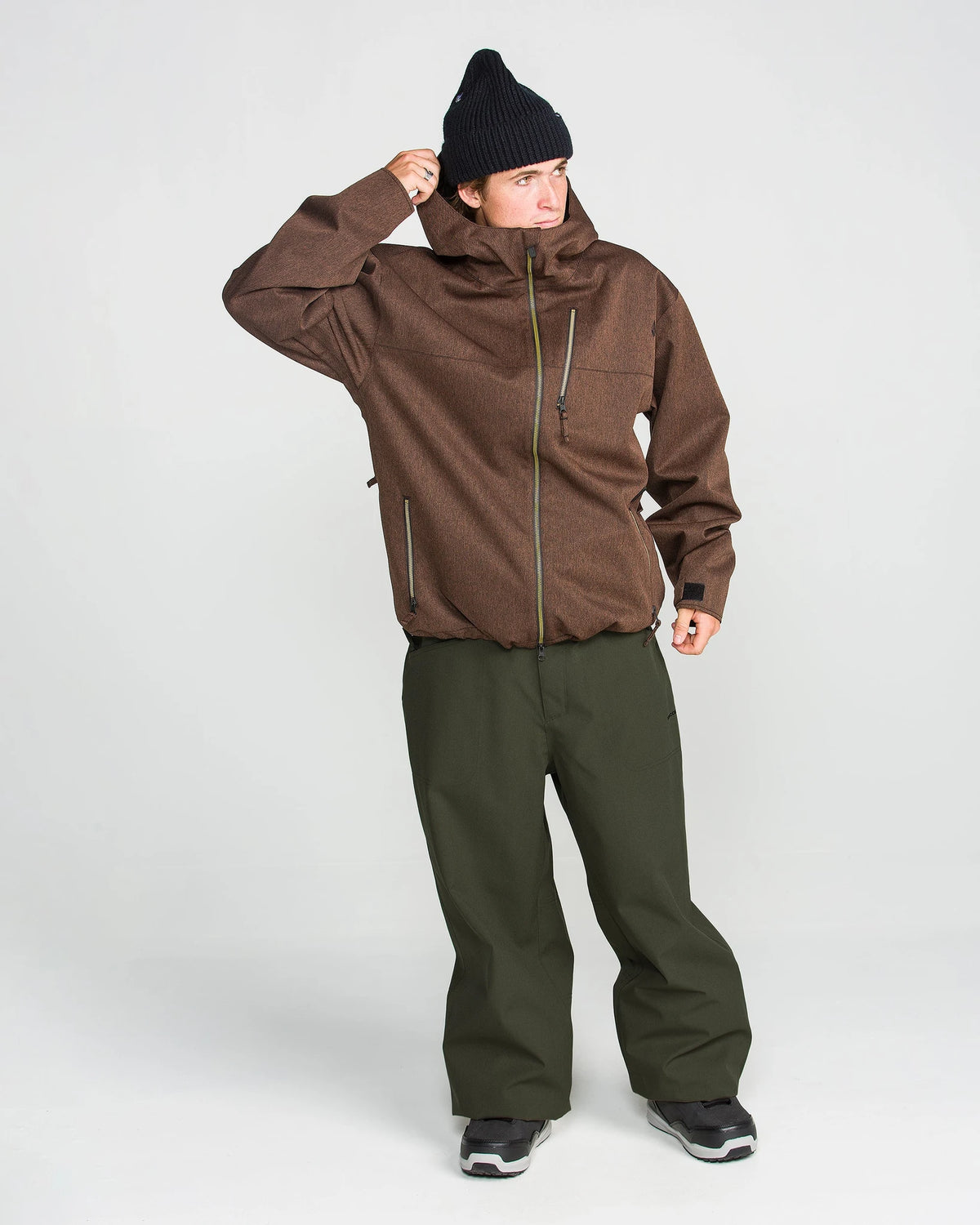 Volcom men's Lapper snow pants in dark green, side view with adjustable waist and reinforced cuffs