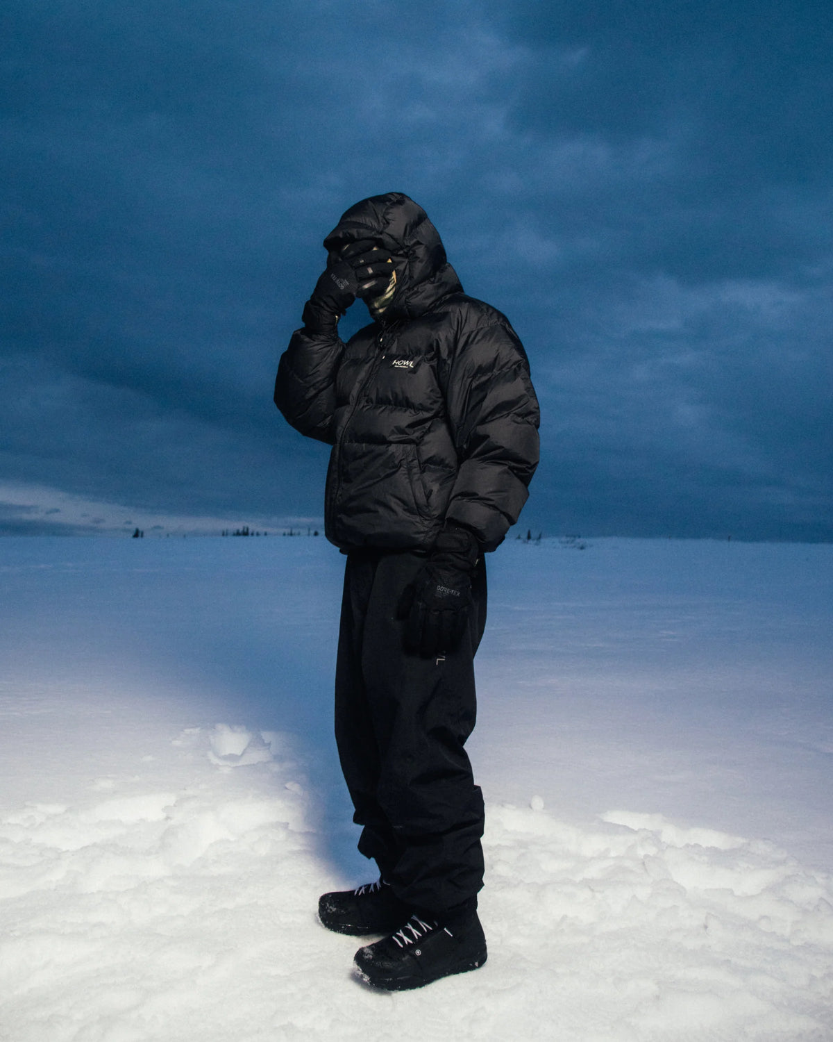 Black Howl Supply puffy snow jacket for men, featuring a padded design and winter warmth, suitable for cold weather outdoor activities.