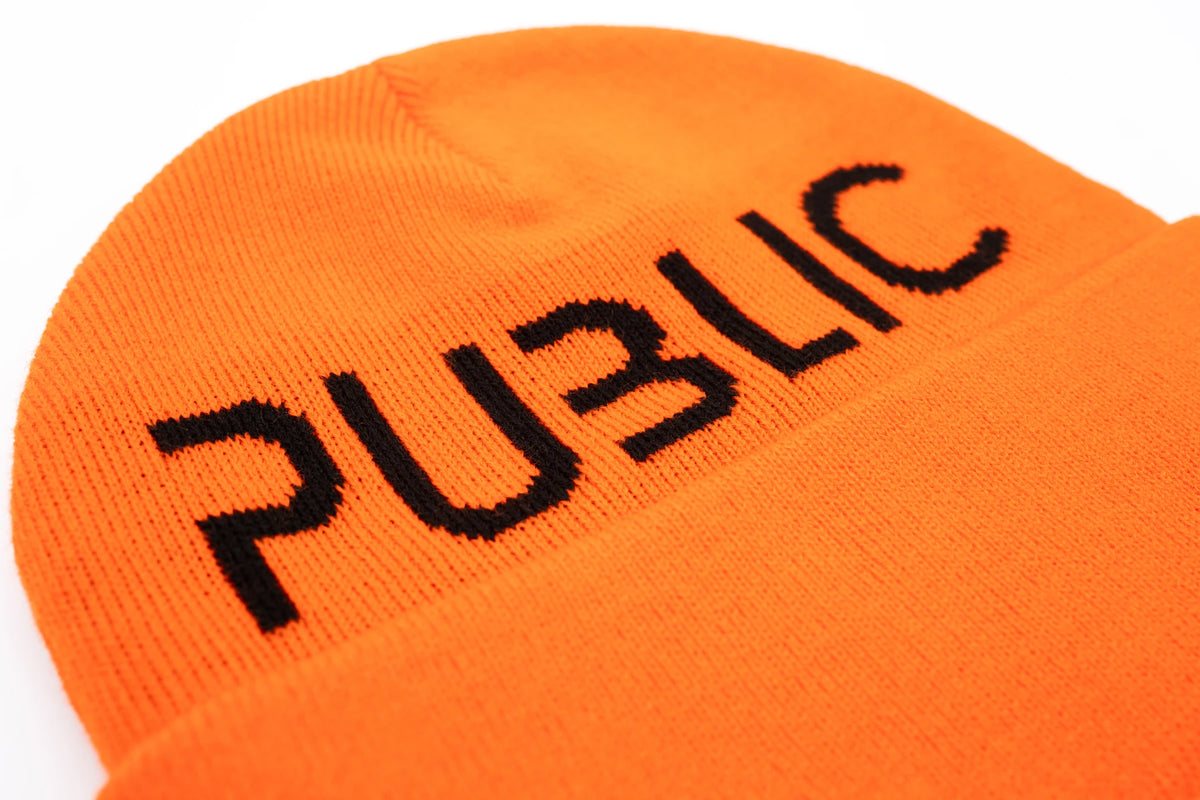 Orange Public Snowboards logo cuff beanie showing the branded logo detail on a soft knit fabric.