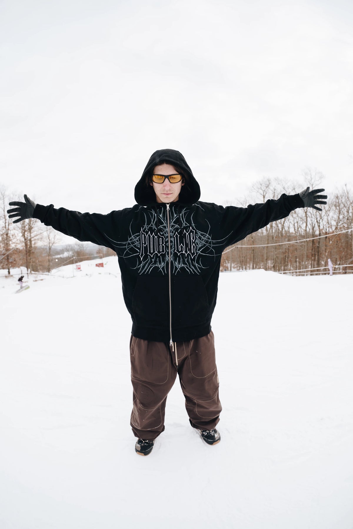 Black men's zip-up hoodie from Public Snowboards, featuring a casual fit and front pockets, ideal for everyday wear.