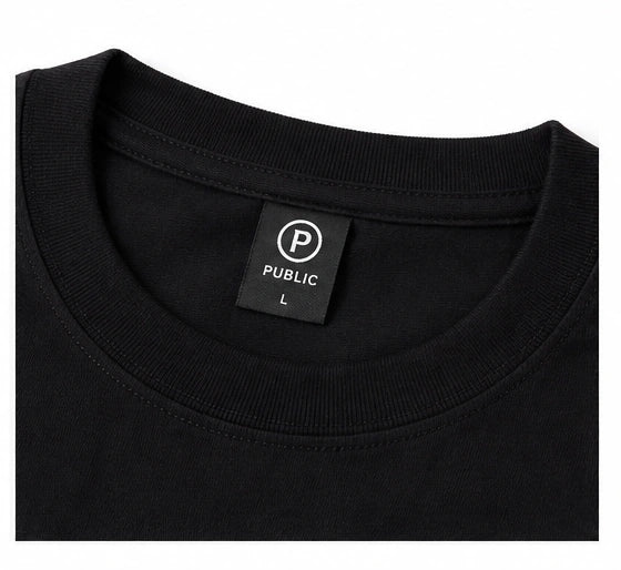 Black Public Glow long sleeve men's tee with subtle branding and a sleek, comfortable fit, featuring a classic crew neck design.