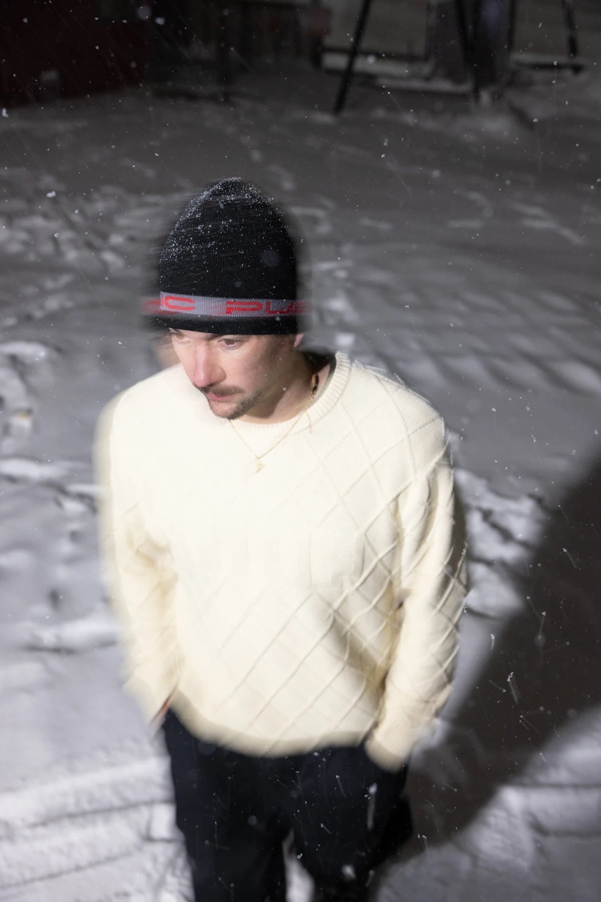 Public Snowboards black and red stretch logo skully beanie worn as a stylish winter accessory.