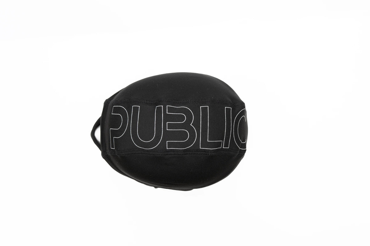 Black Public Tech Balaclava by Public Snowboards for snow face protection, featuring a logo at the top, designed for winter outdoor activities.
