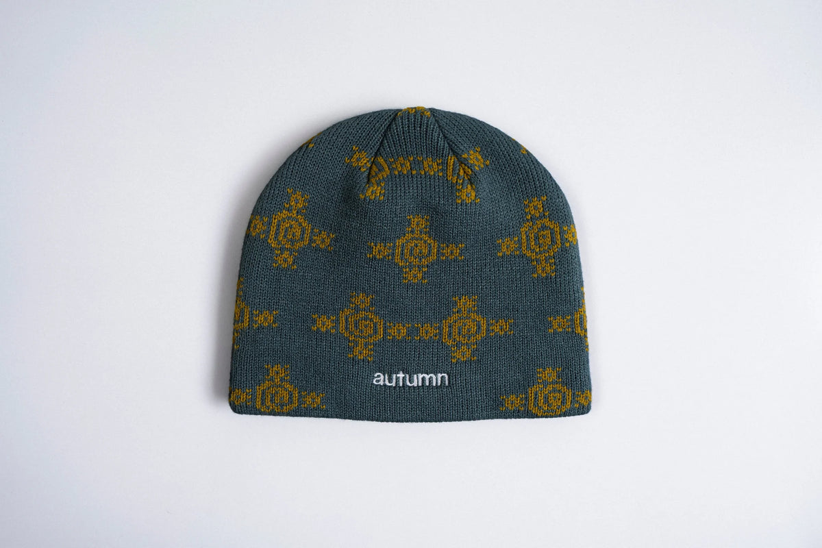 Slate-colored Autumn Glyphs beanie by Autumn Headwear featuring a stylish knit pattern, perfect for cozy fall accessories.