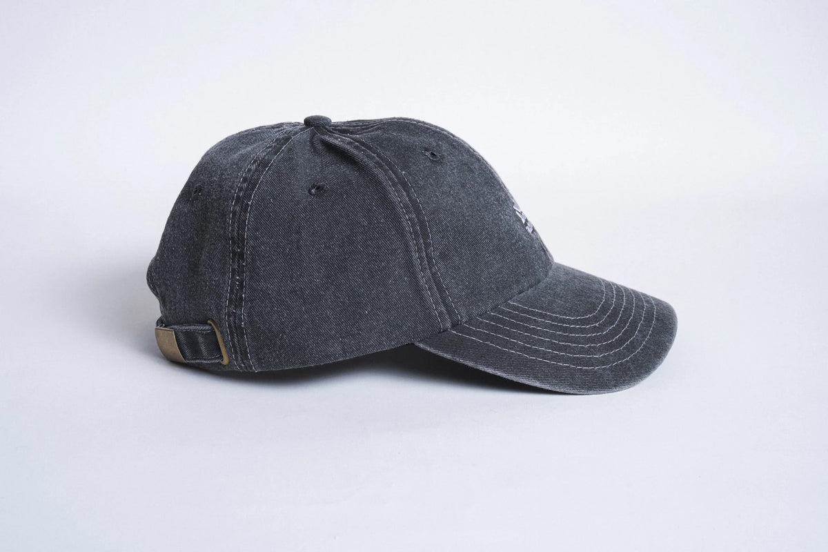 Black Autumn Six Panel Strapback hat from Autumn Headwear, showing front and side view with adjustable strap.