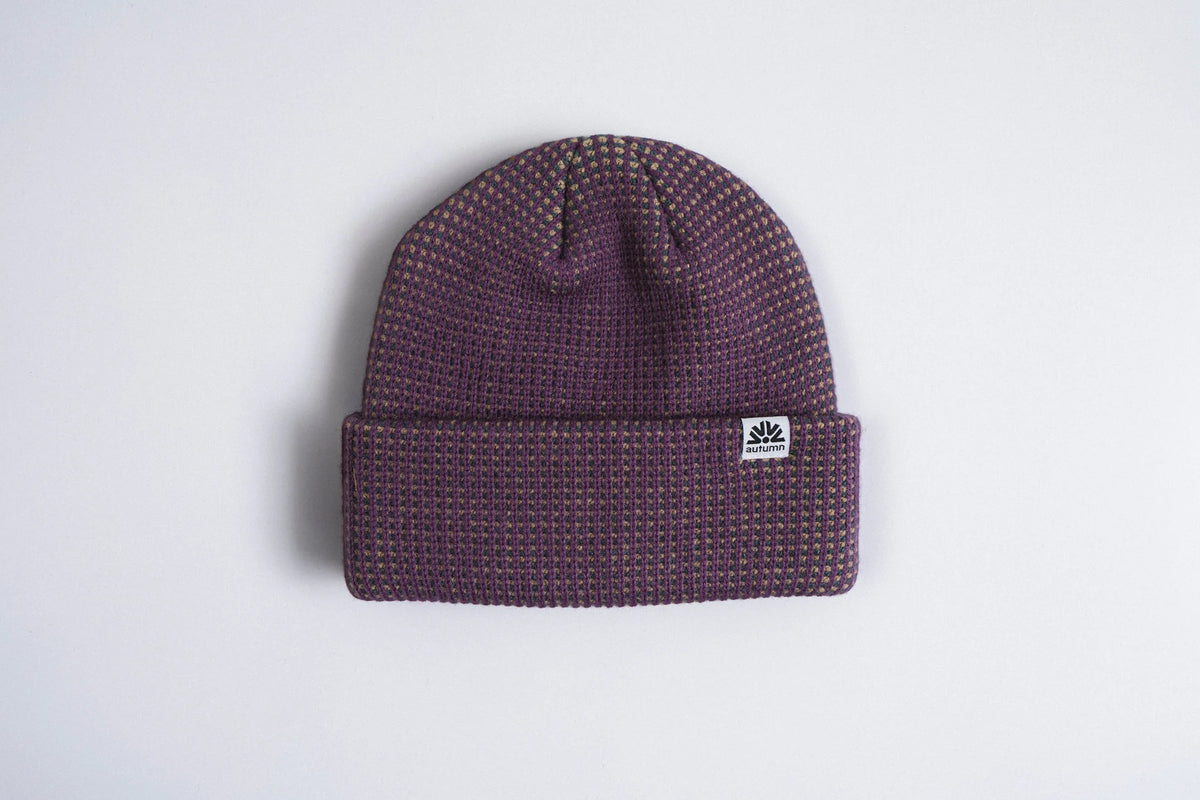 Autumn Headwear Plum Static Beanie, cozy knit accessory in deep plum color, designed for warmth and style.