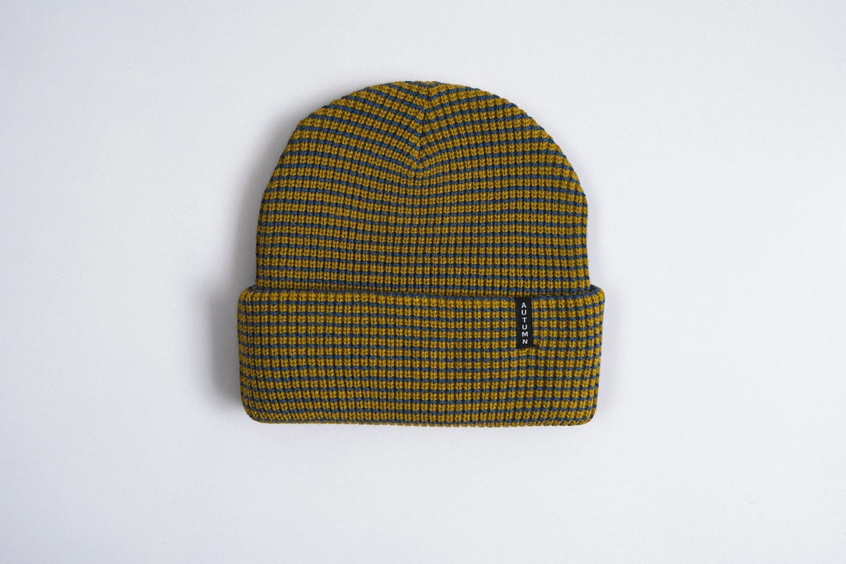 Autumn Headwear Autumn Stripe Beanie in Dijon with warm, cozy knit fabric and colorful striped pattern for stylish winter wear.