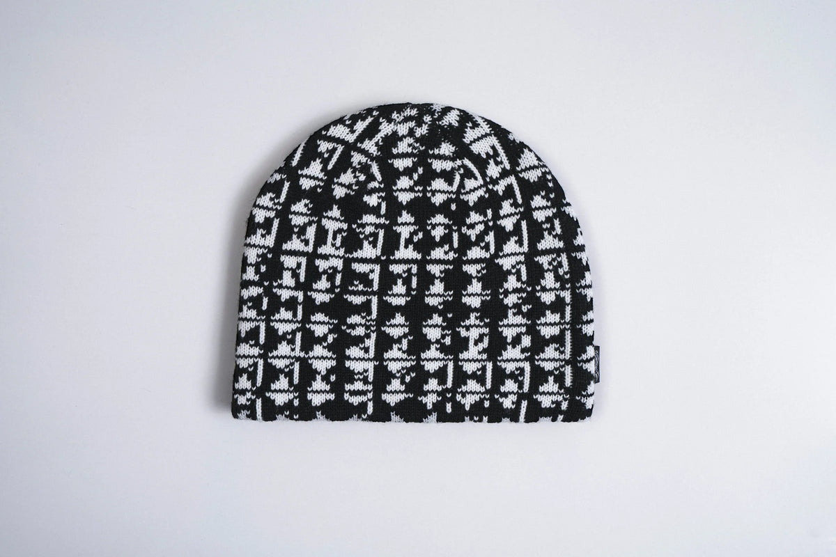 Black corduroy skully beanie with metal stud accents, stylish accessory by Corduroy Headwear, designed for a trendy, edgy look.