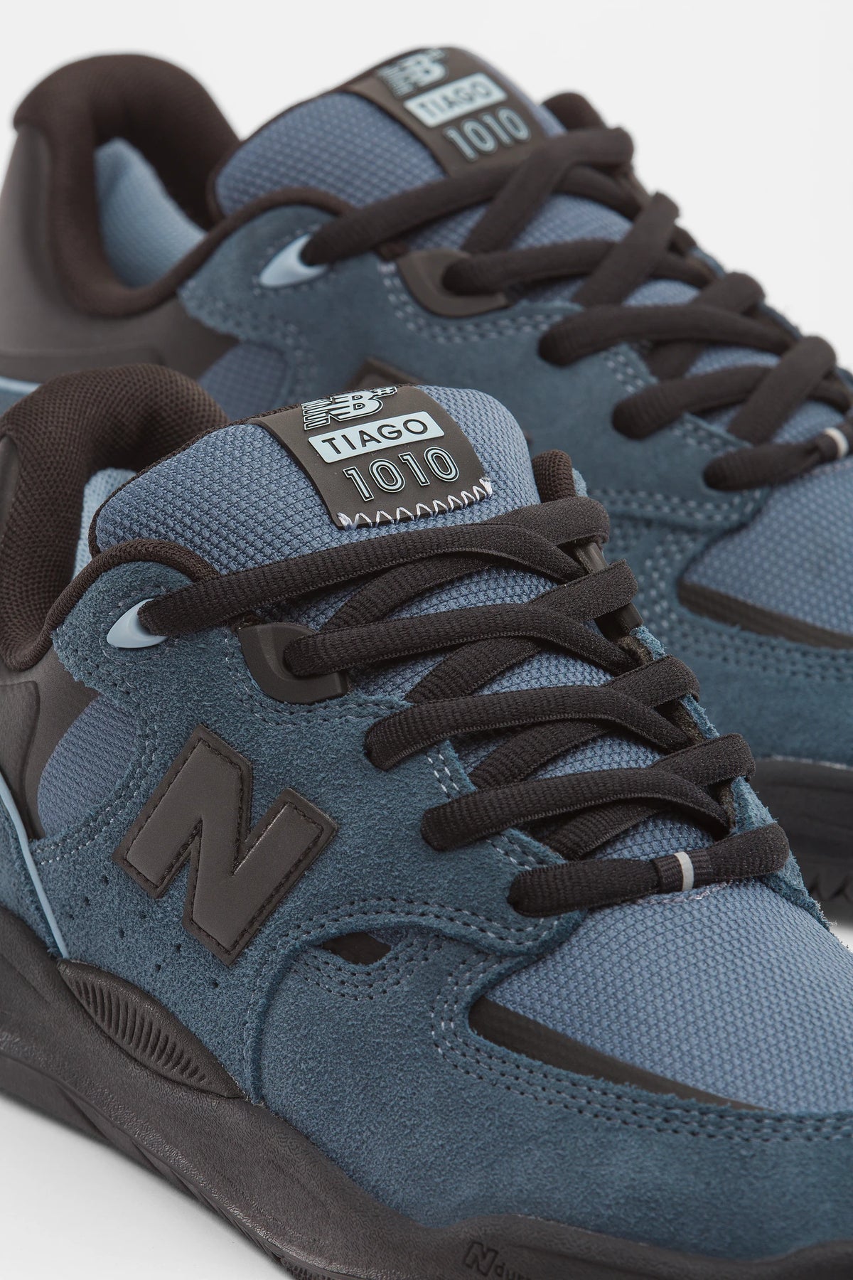 New Balance Numeric Tiago Lemos 1010 skate shoes in shadow blue and black, studio detail view