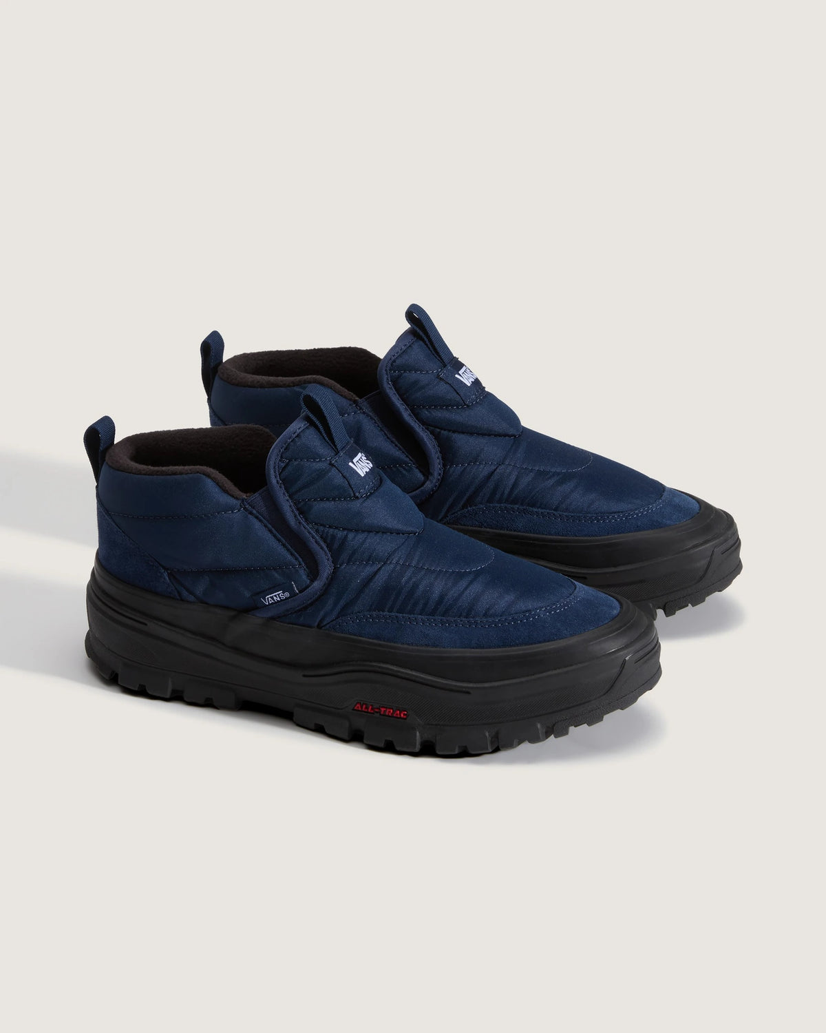 Vans Mid-Slip Puff shoes in true navy with slip-on design and padded upper
