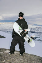 Bataleon 2027 Blaster Pro AW FASE snowboard bindings for men in tor gray, shown in a lifestyle setting for snowboarding.