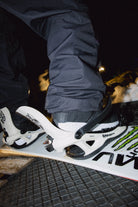 Bataleon Ghost FASE snowboard bindings for men in bone white, featuring a sturdy hardgoods design for snowboarding.