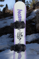 Bataleon Women's Disaster snowboard in a lifestyle setting, showcasing the snowboard's design and build for women snowboarding.
