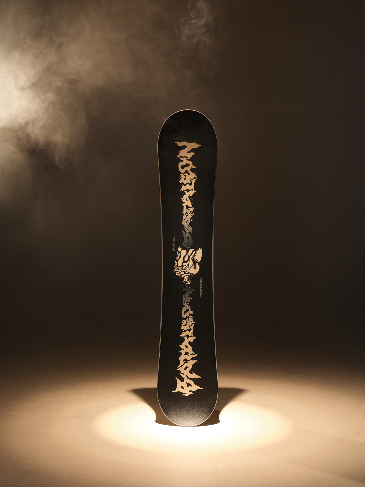 2027 Bataleon Disaster+ snowboard for men, showcasing the snowboard's design and graphics in a lifestyle setting.