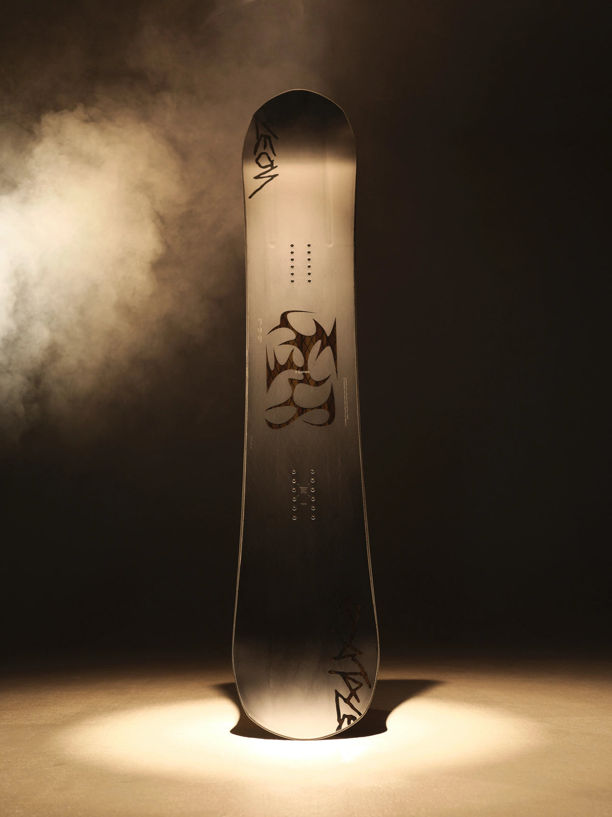 2027 Bataleon Evil Twin+ snowboard in a lifestyle setting, showcasing the men's all-mountain twin snowboard design.