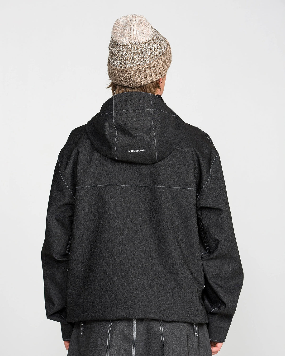 Volcom men's Top Stitch snow jacket in black denim, front three-quarter view