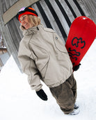 Volcom Unisex Liftline 20K snow jacket in khaki, shown in a snowboard lifestyle setting