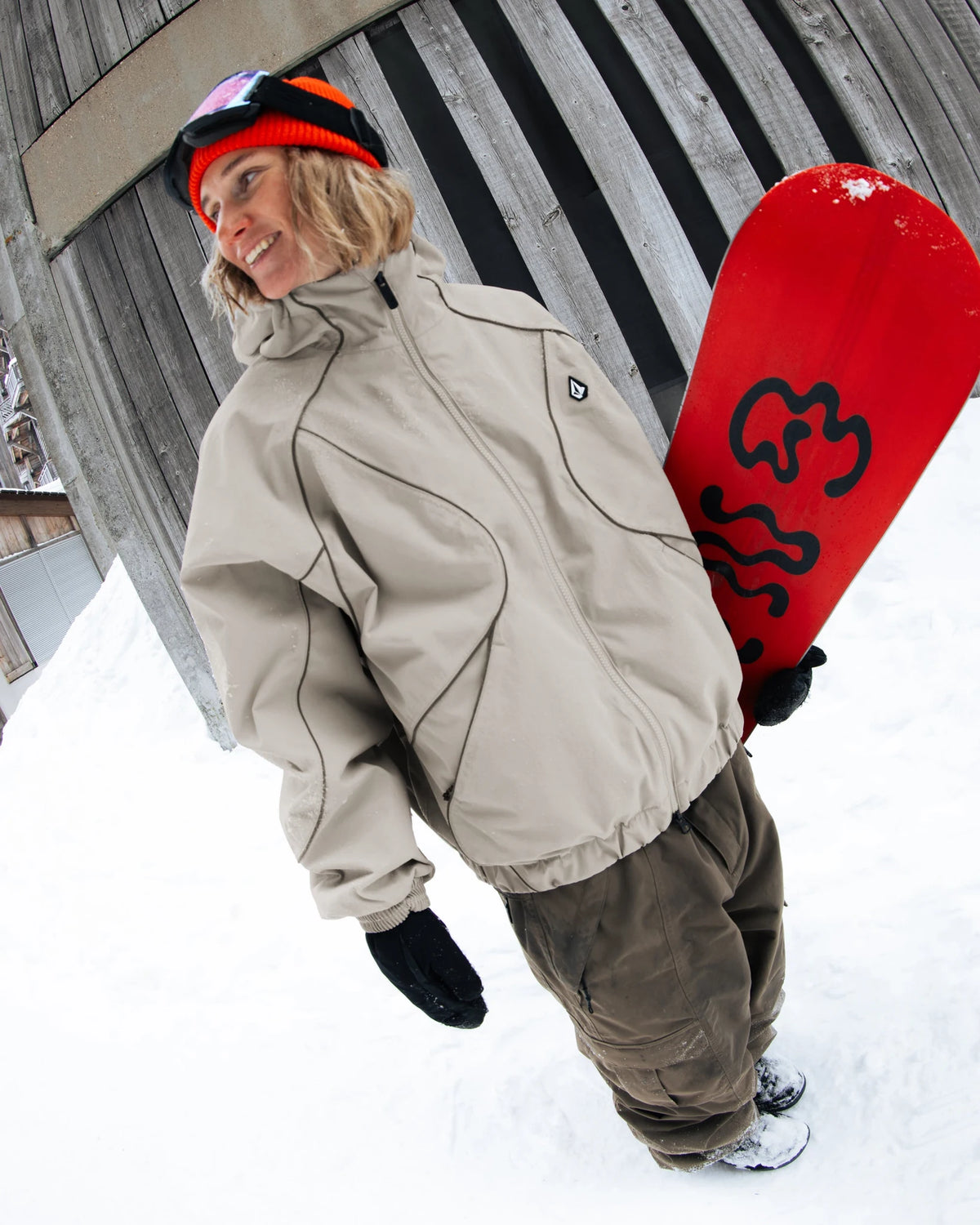 Volcom Unisex Liftline 20K snow jacket in khaki, shown in a snowboard lifestyle setting