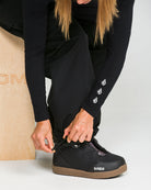 Volcom Unisex Liftline 20K snow pants in black, side view with waterproof design and zippered pockets