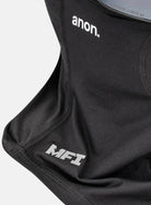 Black ski mask neck gaiter with an integrated black ski/goggle strap, featuring the 'anon.' and 'MFI' logos, shown with a dark mirrored lens on a light gray background.
