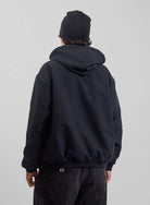 Back view of Burton AG Toughy reversible men's full-zip hoodie in true black and dirty money color, showing the hoodie’s design and fit.