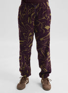 Back view of Burton men's Cinder Pants in Liquid Bear Hug color, showcasing the relaxed fit and durable fabric.