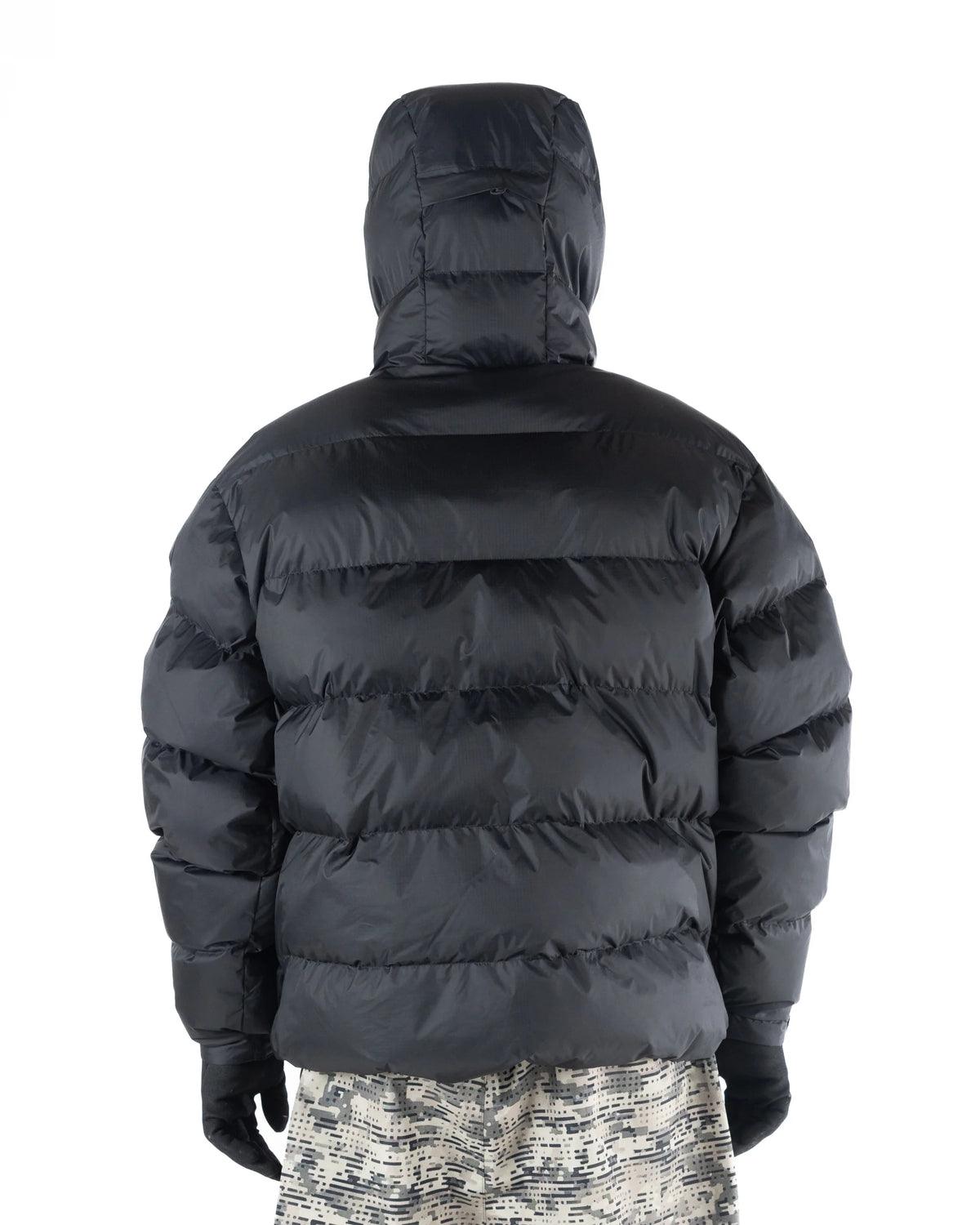 Back view of Howl Supply black puffy men's snow jacket, insulated softgoods with a quilted design and hood for cold weather.