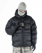 Black Howl Supply puffy men's snow jacket with front pockets, designed for warmth and style in cold weather.