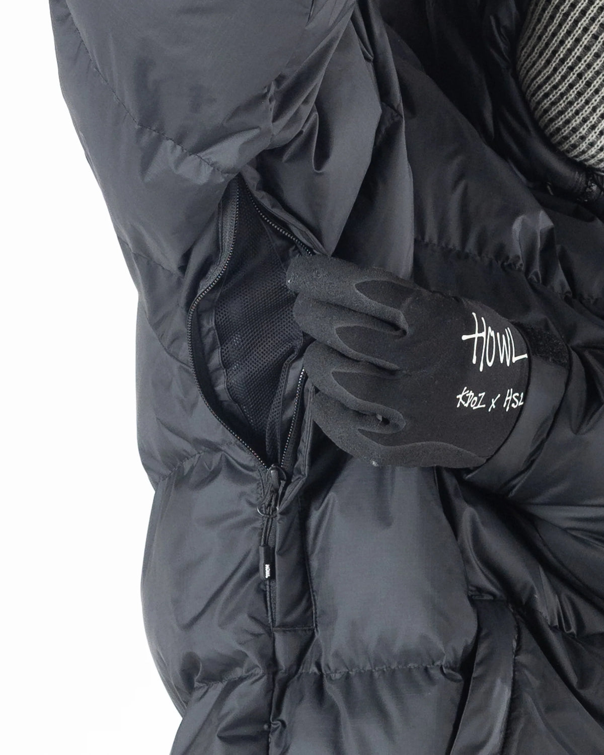 Men's black Howl Supply puffy snow jacket with a quilted design and hood, suitable for cold weather.