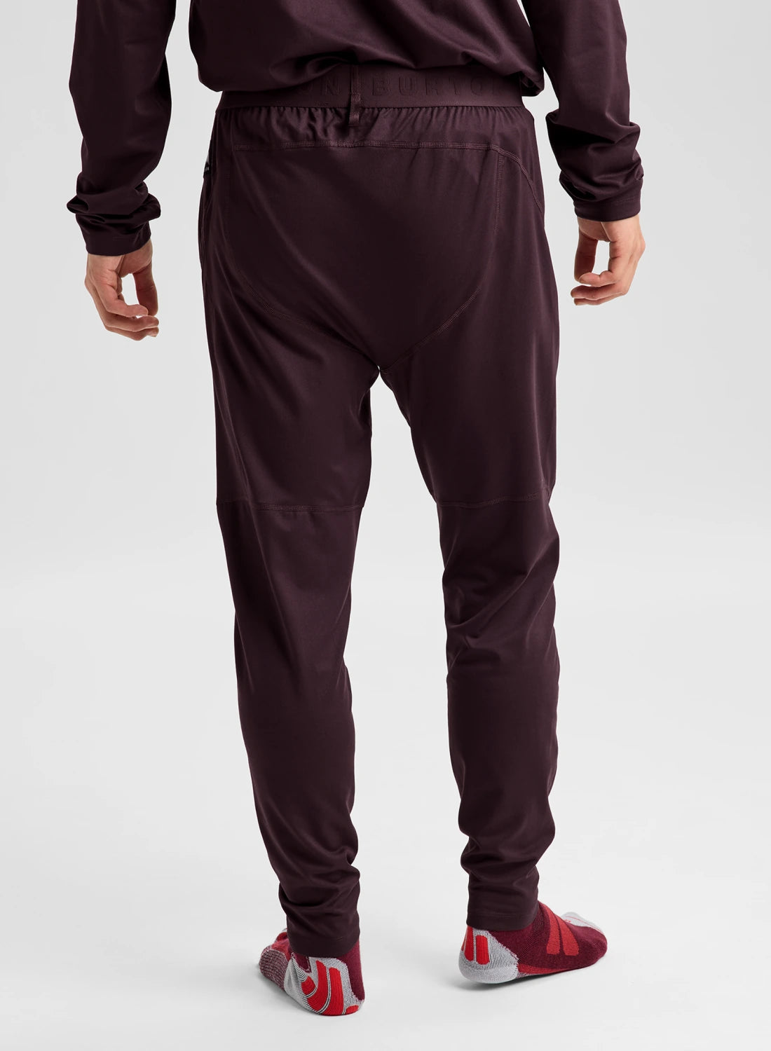 Men's Burton synthetic midweight base layer pants in Bear Hug Brown, shown from the back, designed for snow and cold weather layering.
