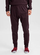 Men's Burton synthetic midweight base layer pants in Bear Hug Brown, front view showing soft, insulating fabric for cold-weather layering.