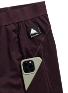 Men's Burton synthetic midweight base layer pants in Bear Hug Brown, featuring pocket details for snow outdoor layering.