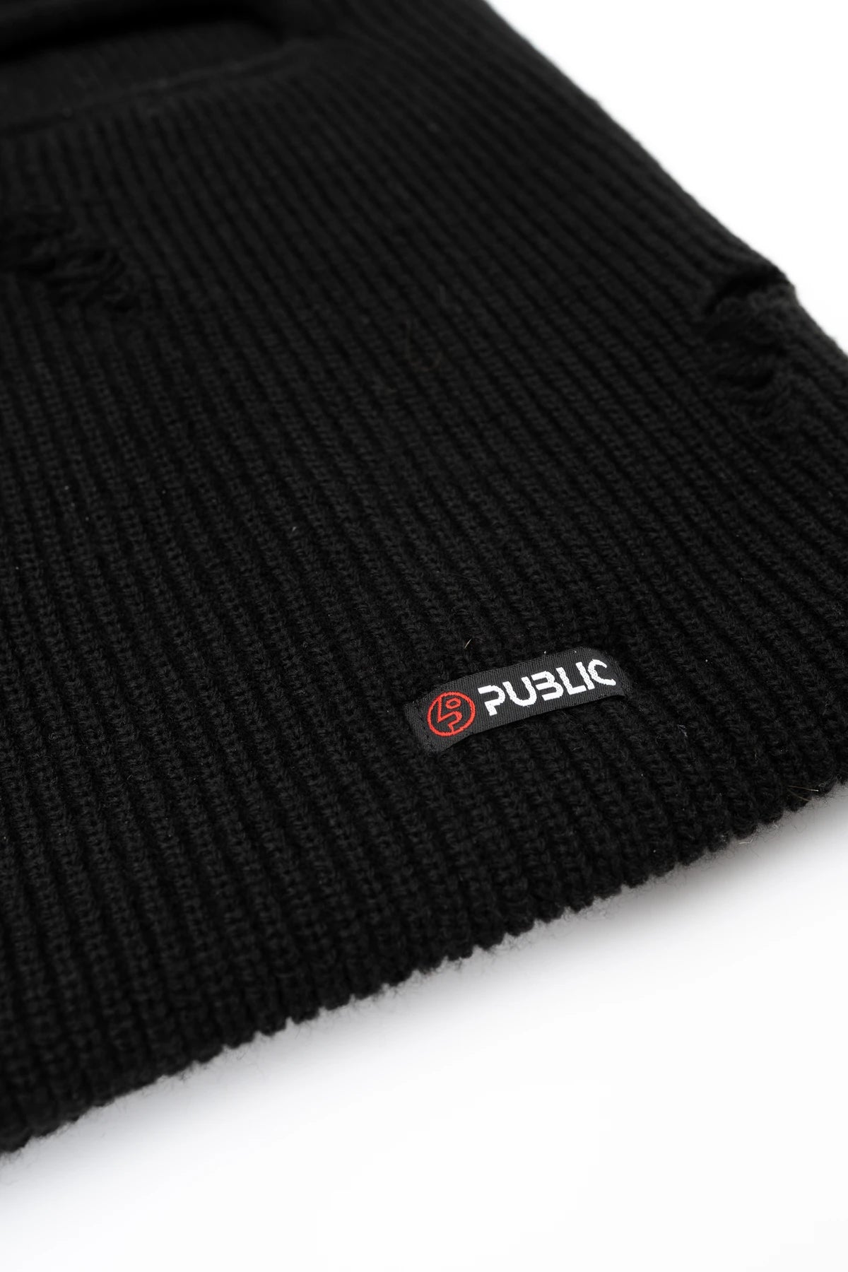 Public Snowboards distressed black balaclava with logo detail, designed for snow face protection and winter outdoor activities.