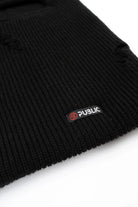 Public Snowboards distressed black balaclava with logo detail, designed for snow face protection and winter outdoor activities.