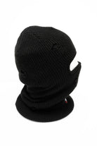 Public Snowboards distressed black balaclava worn on head, providing face protection for snowboarding and winter outdoor activities.