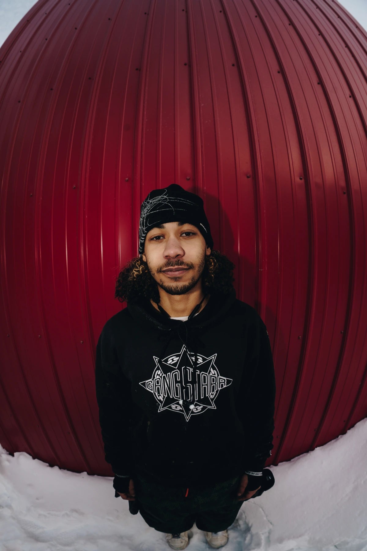 Public Snowboards Black Skully Beanie, cozy knit accessory worn casually, featuring a skull design on the front.