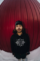 Public Snowboards Black Skully Beanie, cozy knit accessory worn casually, featuring a skull design on the front.