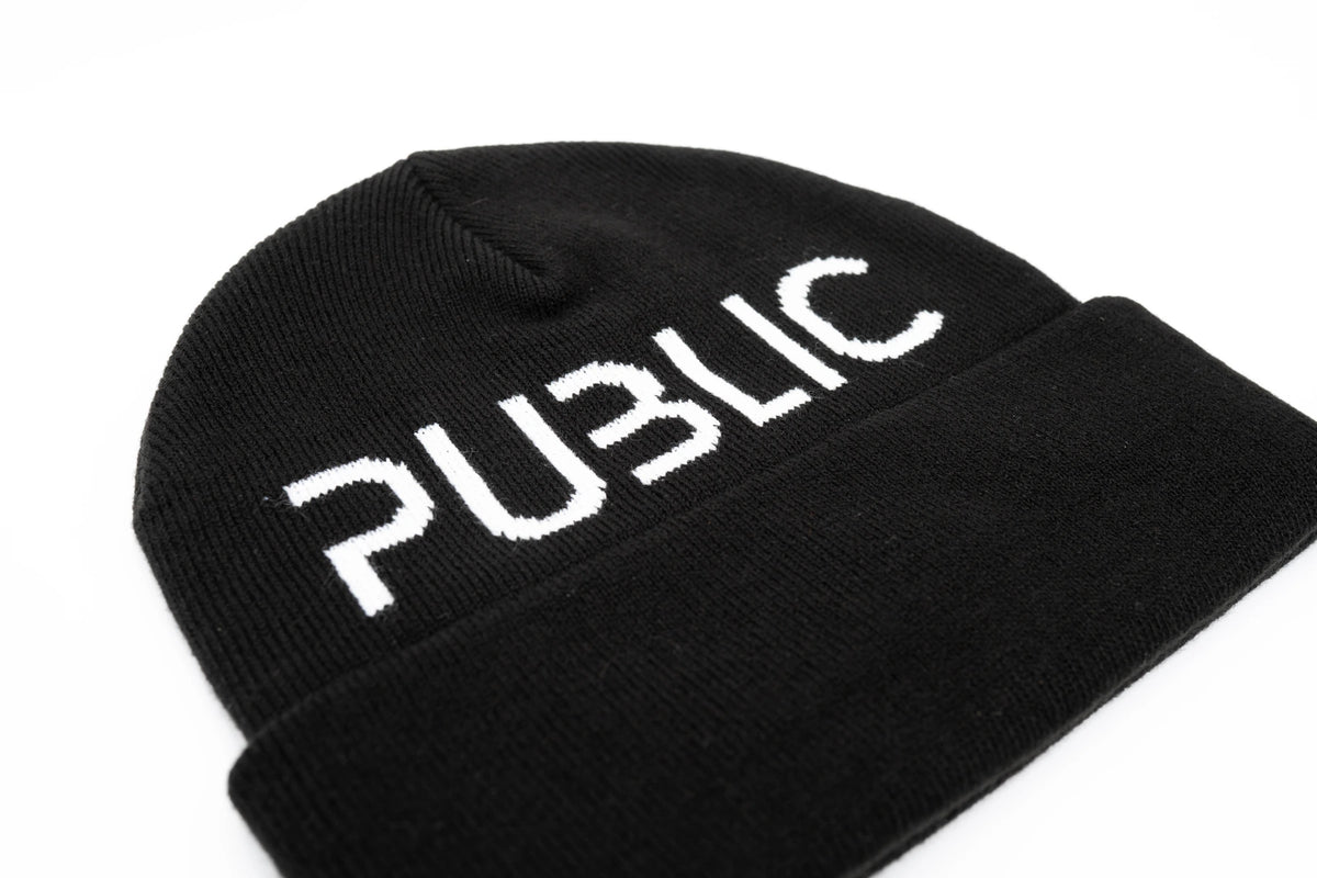 Black Public Logo Cuff Beanie featuring the Public Snowboards logo, made of soft knit material for warmth and style.
