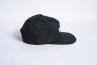 Black Autumn Canvas Six Panel Snapback hat from Autumn Headwear, showing front view with adjustable strap and six-panel design.