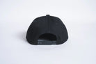 Black Autumn Canvas Six Panel Snapback hat by Autumn Headwear, showing the front view with adjustable strap and six-panel design.