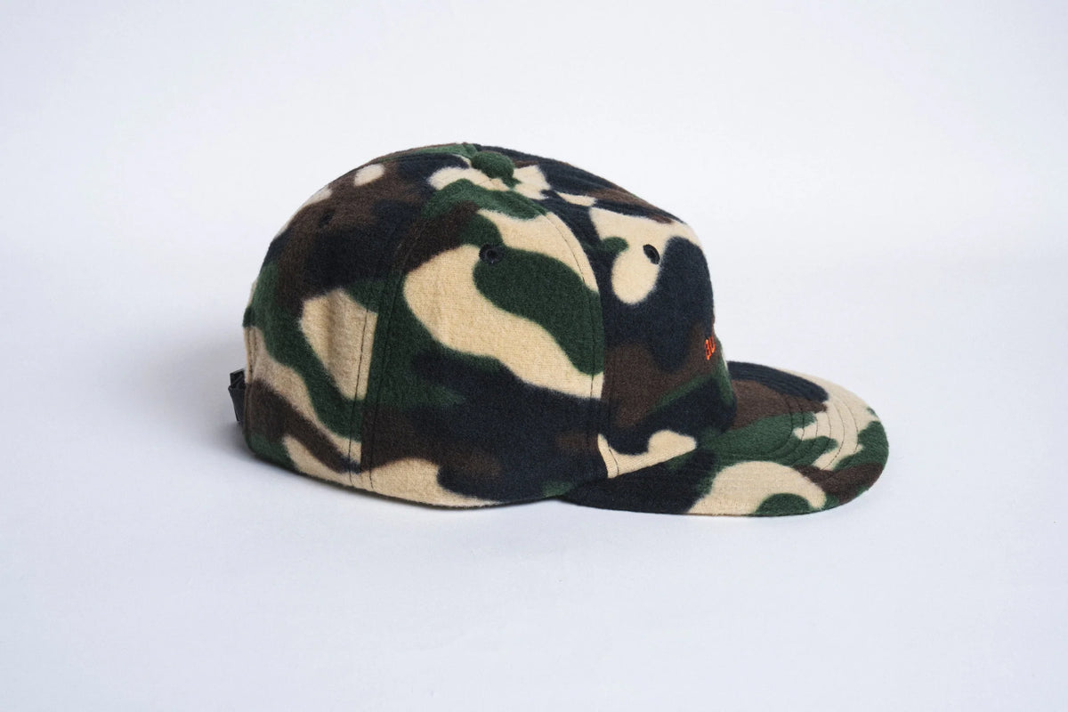 Autumn Headwear six-panel fleece cap in camouflage, stylish accessory with a snug fit and bold camo pattern.