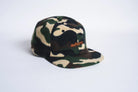 Autumn Headwear six-panel fleece cap in camouflage pattern, stylish outdoor accessory with a warm, cozy fit.