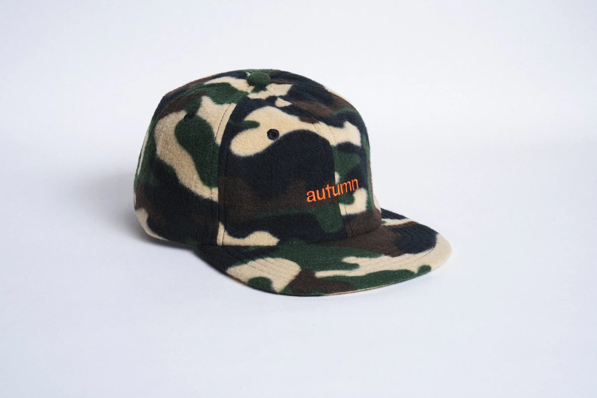 Autumn Headwear six-panel fleece cap in camouflage pattern, stylish outdoor accessory with a warm, cozy fit.