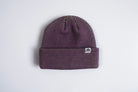 Autumn Headwear Plum Static Beanie, cozy knit accessory in deep plum color, designed for warmth and style.